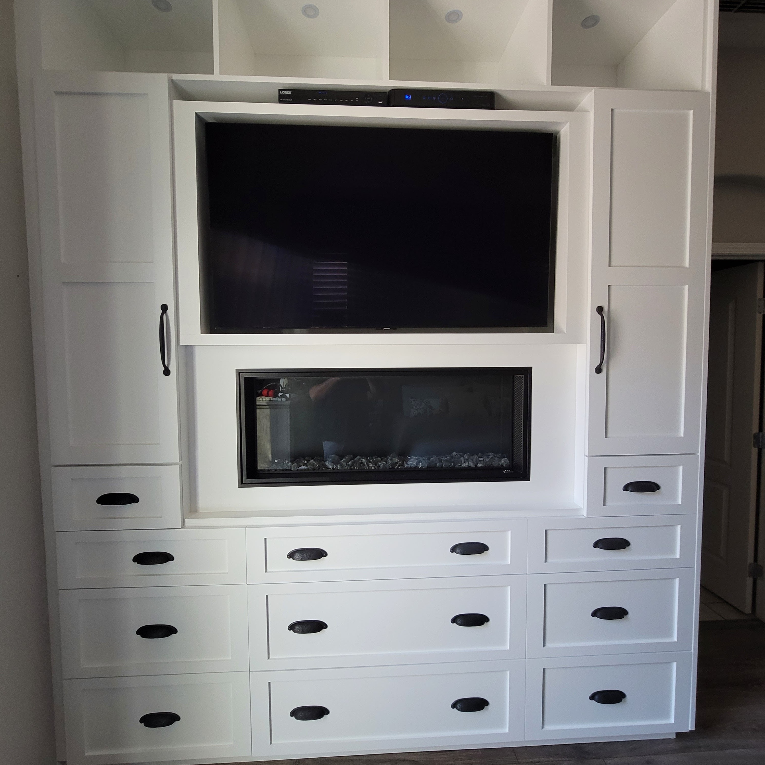 custom cabinets with a built in TV by all pro builders - lightbox